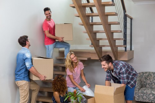 Commercial moving crew handling office furniture and equipment with care