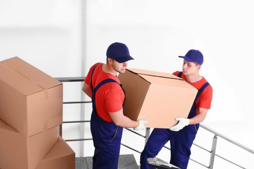 Moving team packing and organizing belongings for a relocation in Denmark