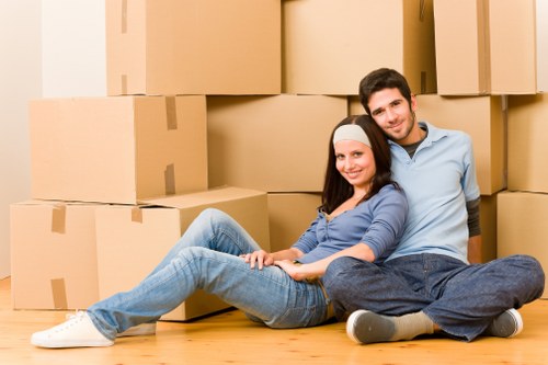 Movers carrying boxes carefully during a safe relocation