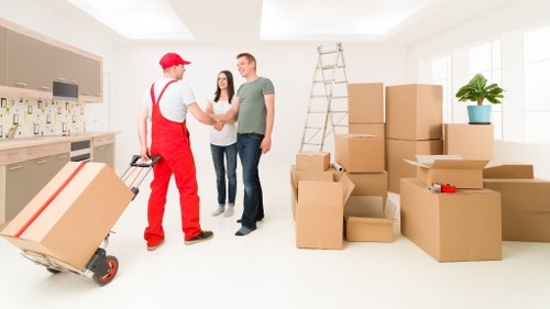 Professional movers loading household items into a truck in Denmark