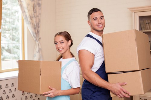 Trained movers handling furniture during a planned relocation
